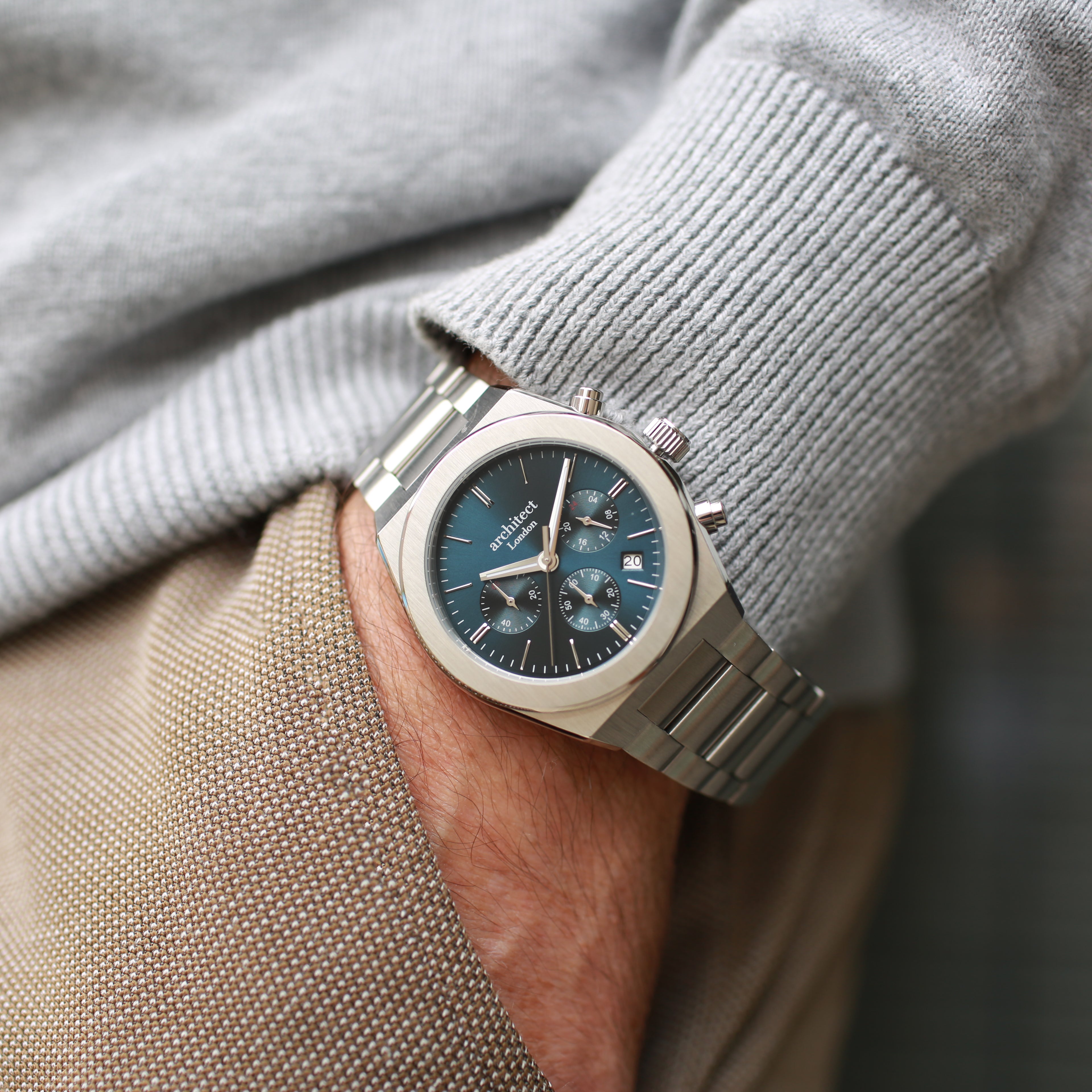 Blue face chronograph watch worn with jumper – Architect Orbix