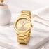 Gold wristwatch on a marble surface with a soft white background - ladies personalised watch