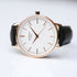 Minimalist ladies rose gold watch with white dial and black leather strap