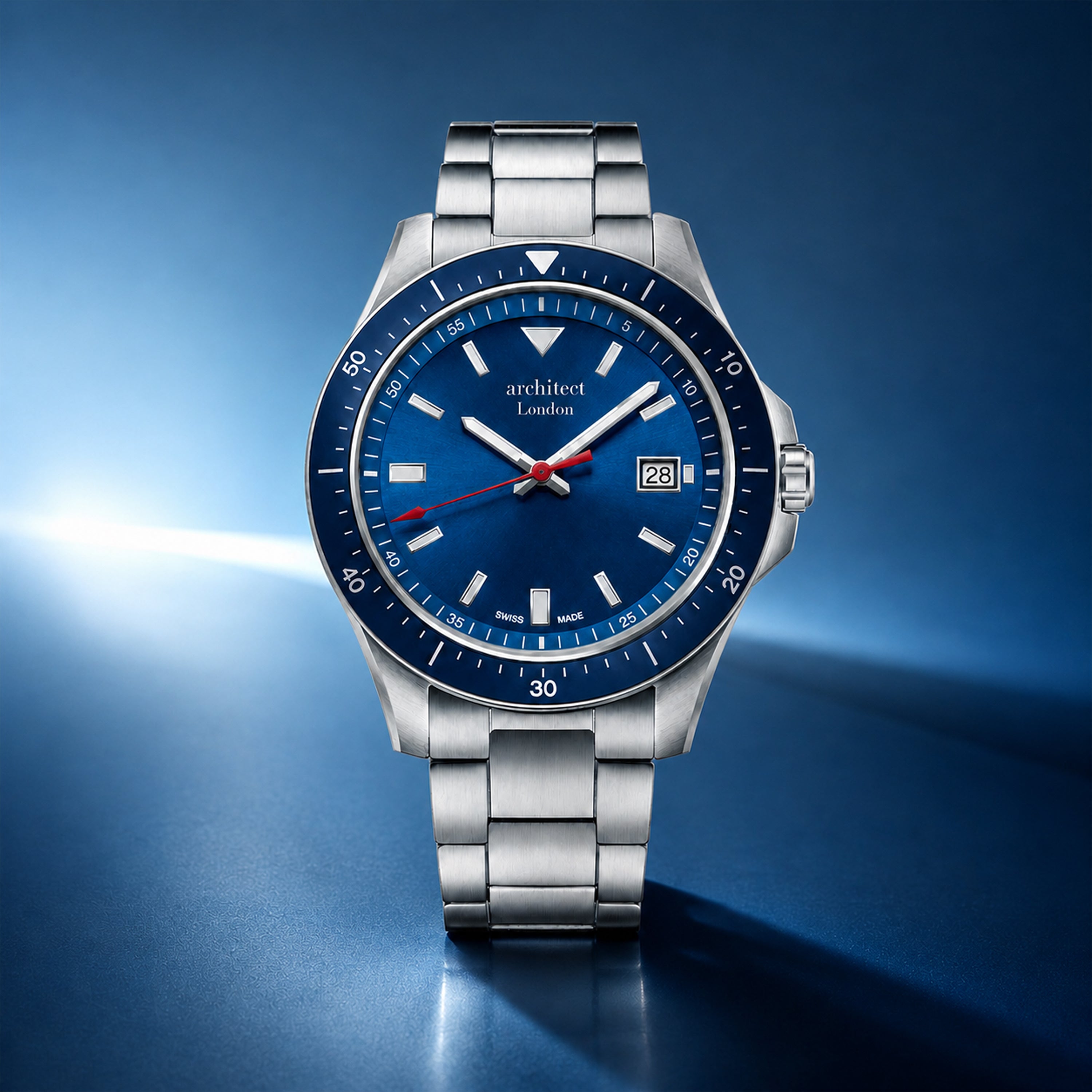 Silver watch with a blue dial on a blue background