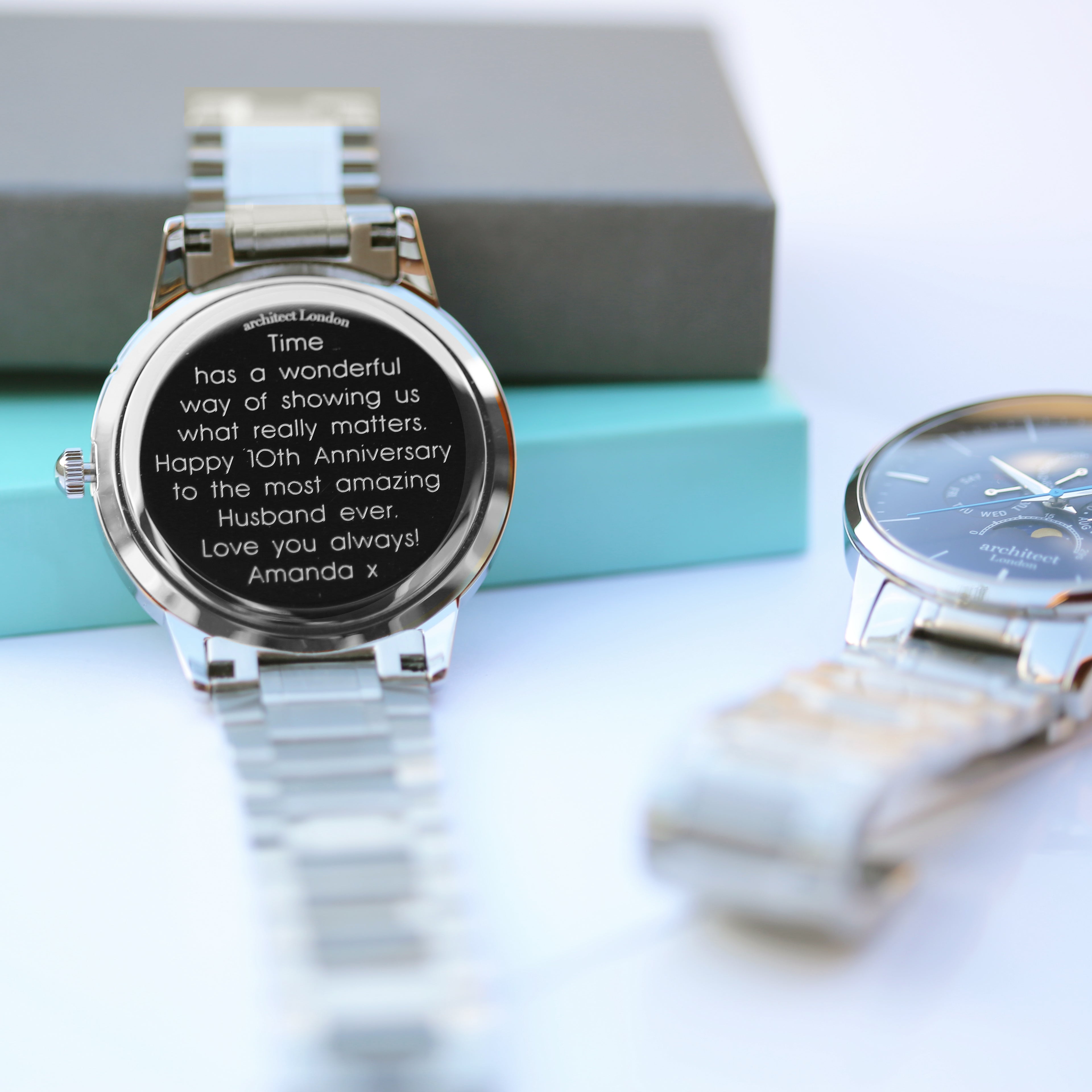 Personalised engraving on back of blue moonphase men’s watch