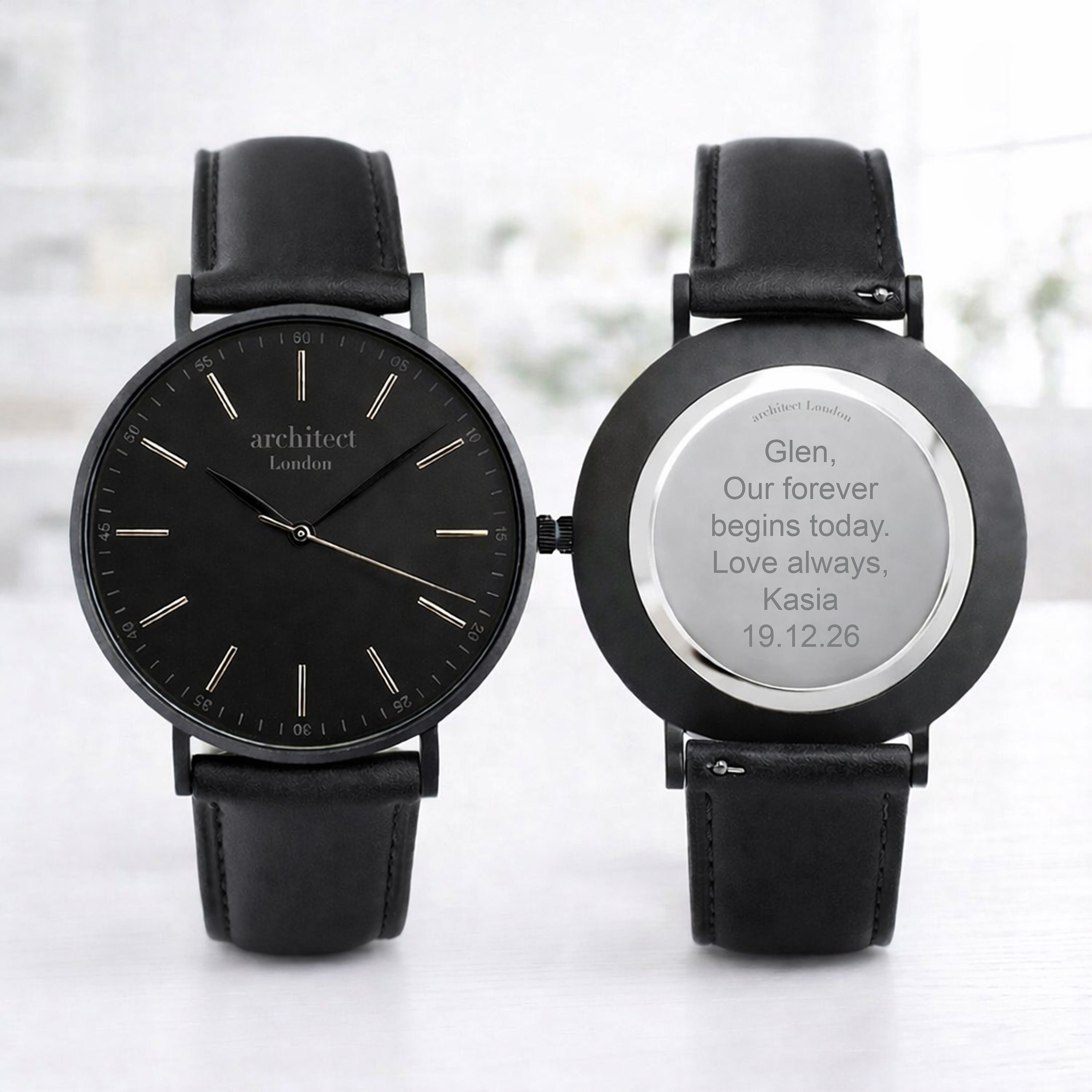 mens personalised watch showing engraving. Black face watch and black leather strap