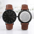 Two brown leather watches with engraved messages on a white background