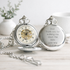 Two silver pocket watches side by side showing skeleton dial and engraved wedding message for Dad